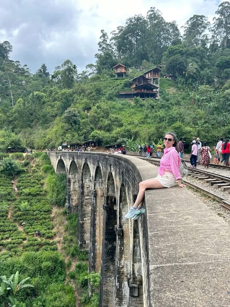 Girl Sitting on Nine Arch Bridge
