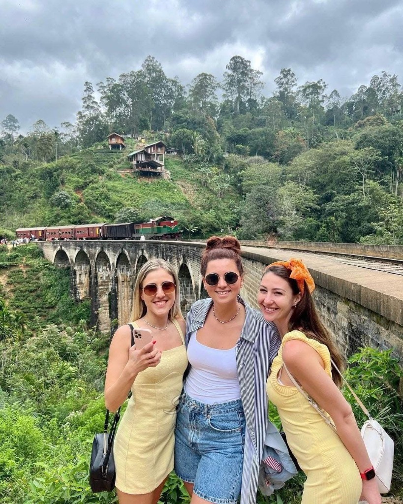 Girls at Nine Arch Bridge with Train